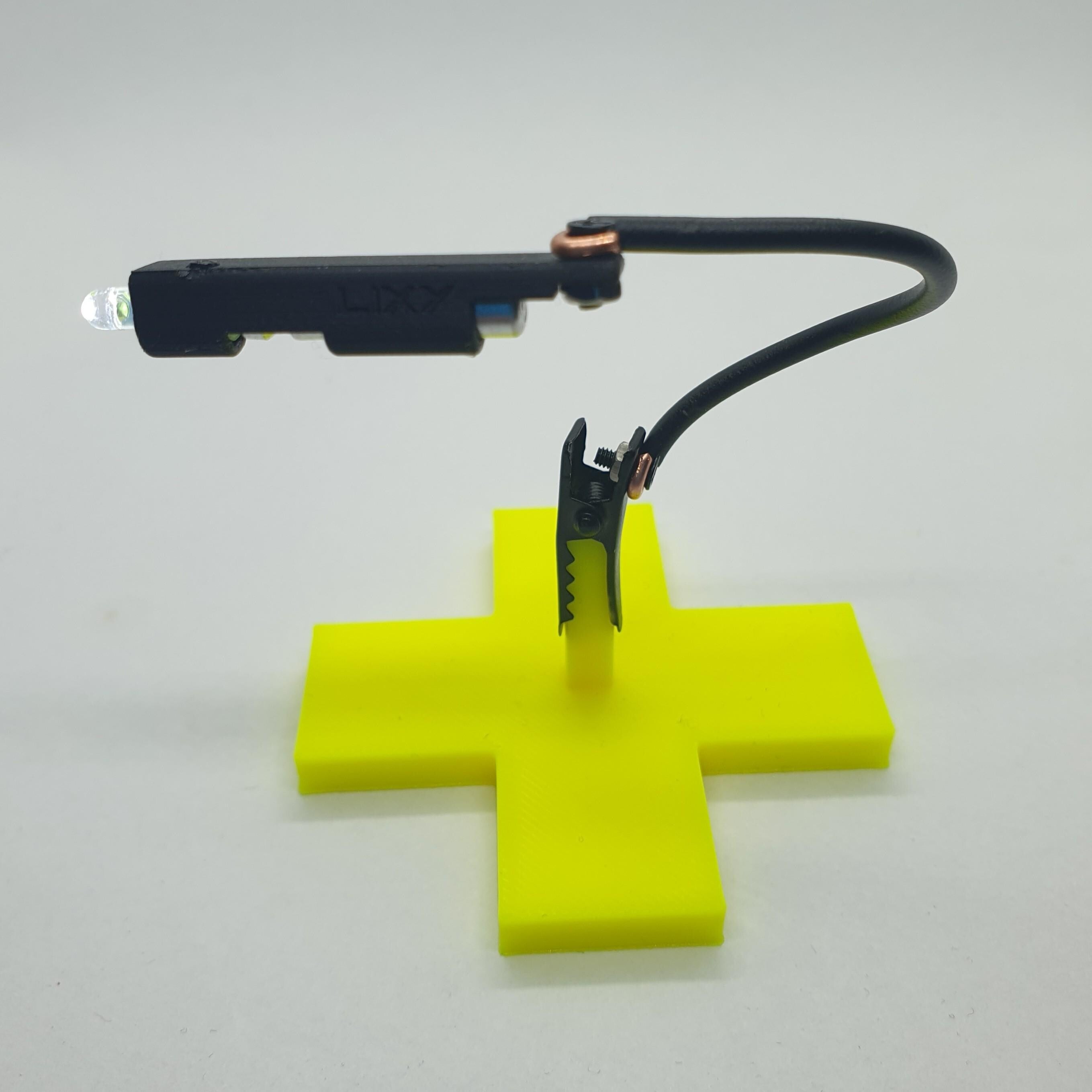 LIXY The world's smallest Micro Nano flashlight with a clip on a flexible arm