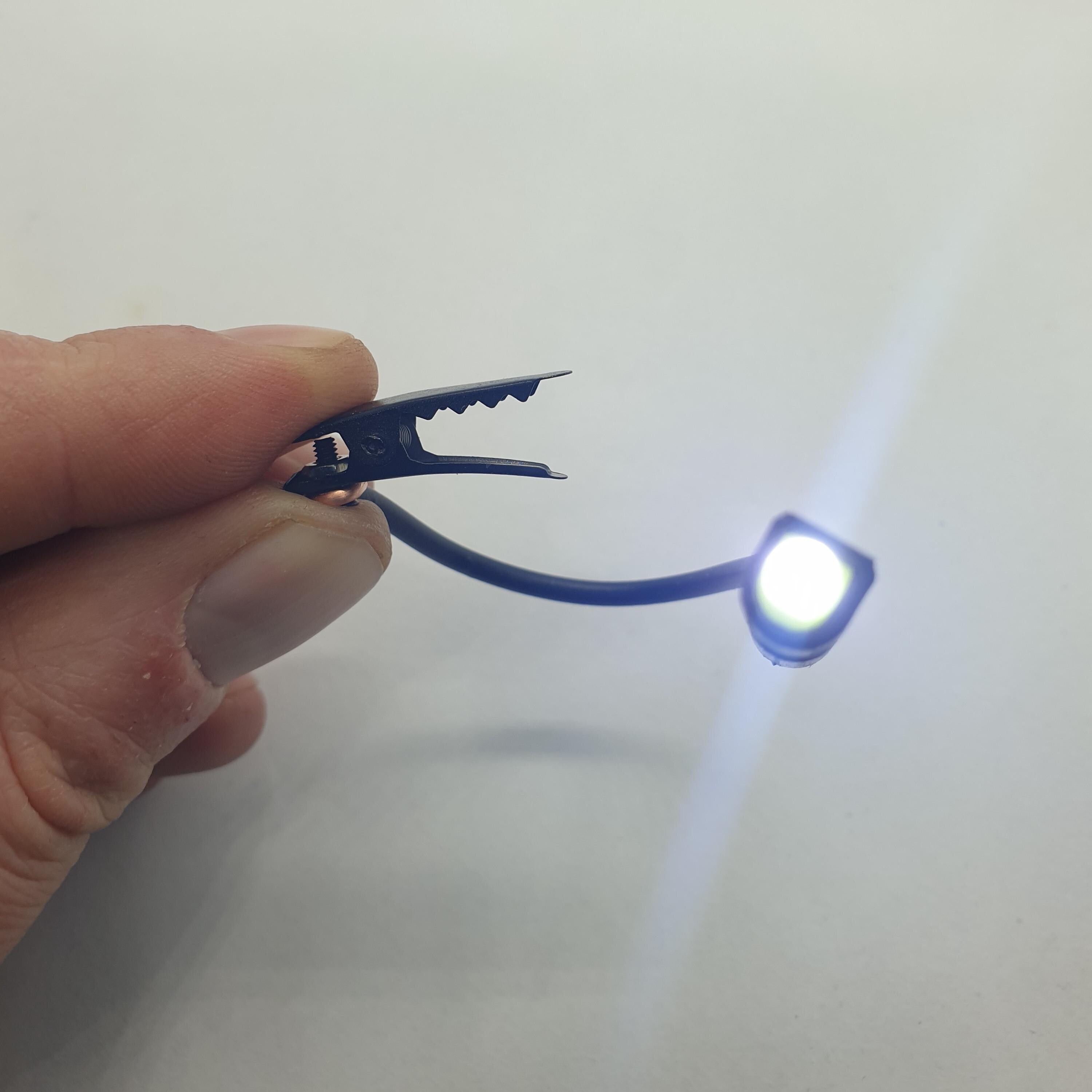 LIXY The world's smallest Micro Nano flashlight with a clip on a flexible arm